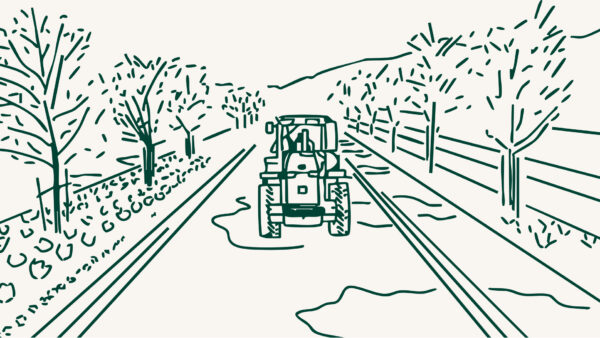 Line drawing of a tractor driving at Utah City.